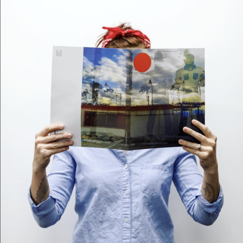 /Student holding Dot Magazine