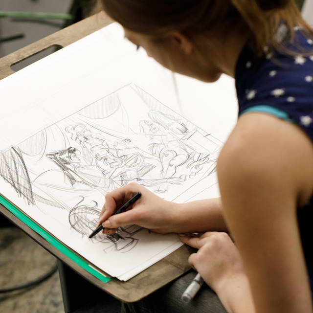 Student sketching in Inventive Costume class