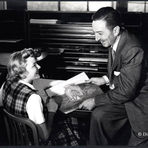 /Ginni Mack, who worked as an inker, and Walt Disney review production artwork from “Alice in Wonderland,” circa 1950. via HuffPo
