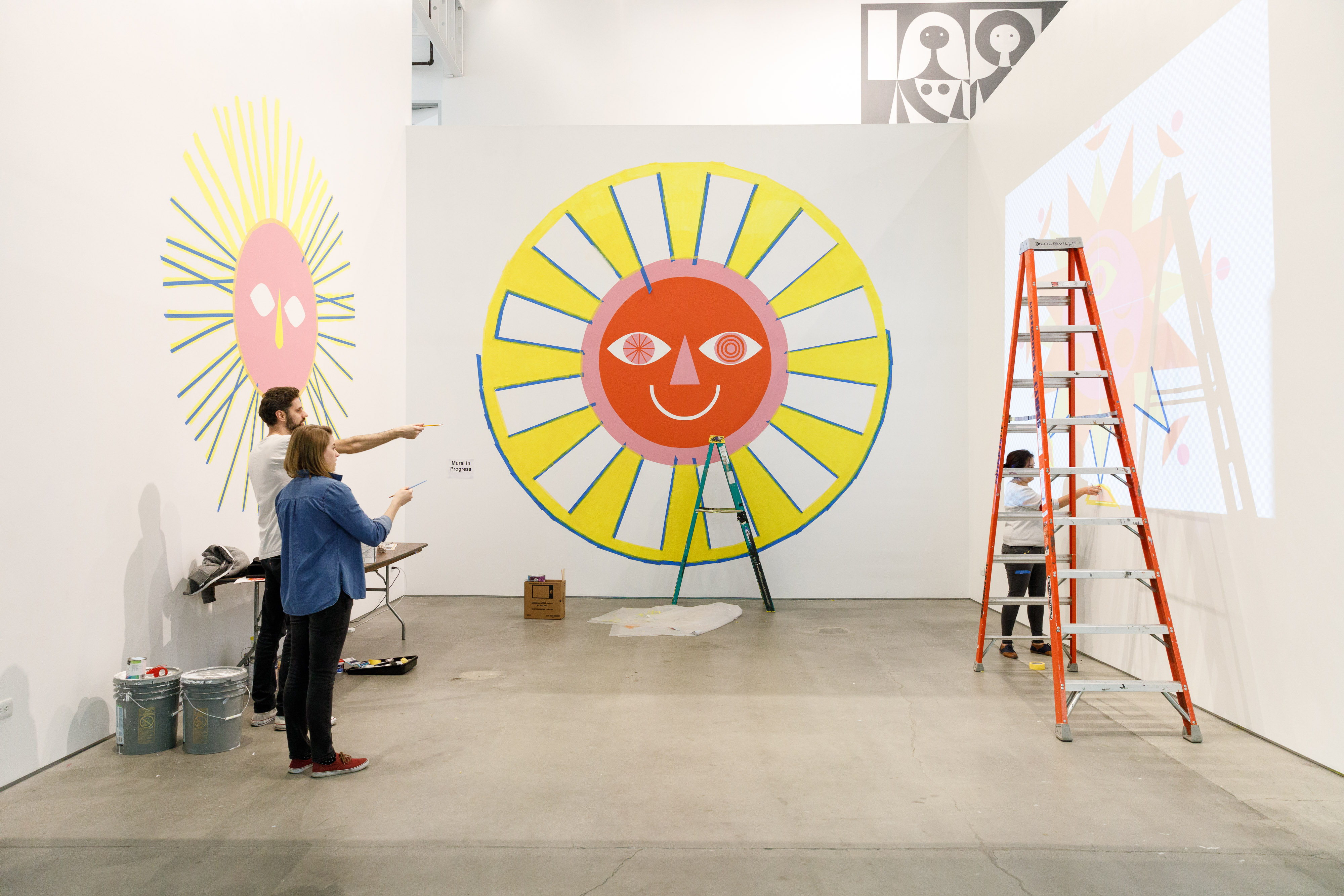 Students creating a mural in 870 gallery.