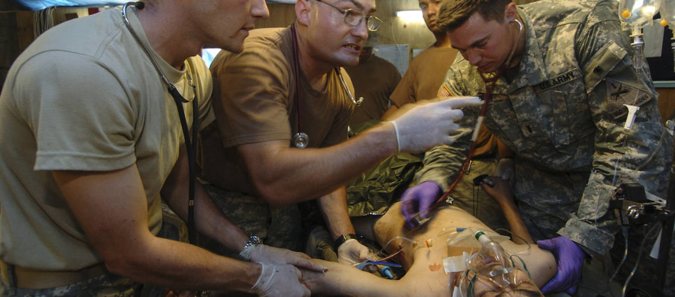 In this photo by veteran and current ArtCenter student Christopher Stoltz, Army medics treat a victim of a bombing in Tikrit, Iraq in 2006.