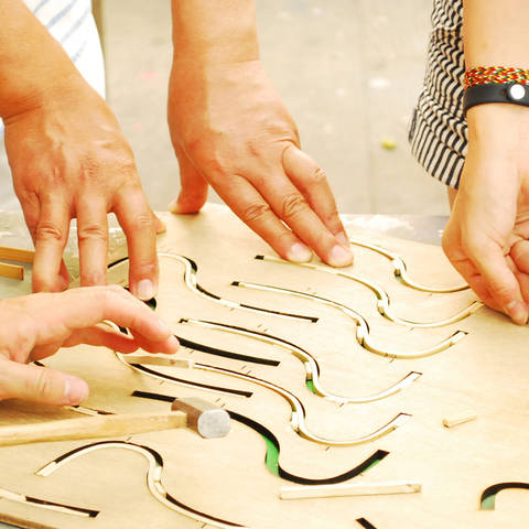 /promo image for kyoto culture craft of hands working on wood