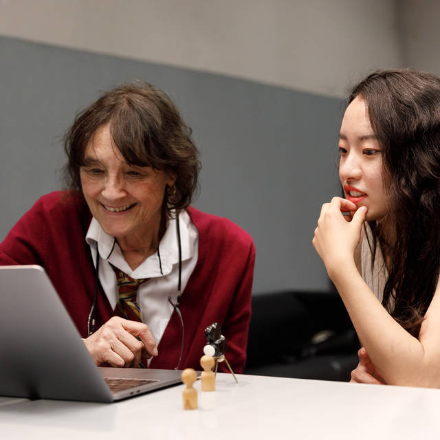 Instructor Victoria Hochberg meets with a student