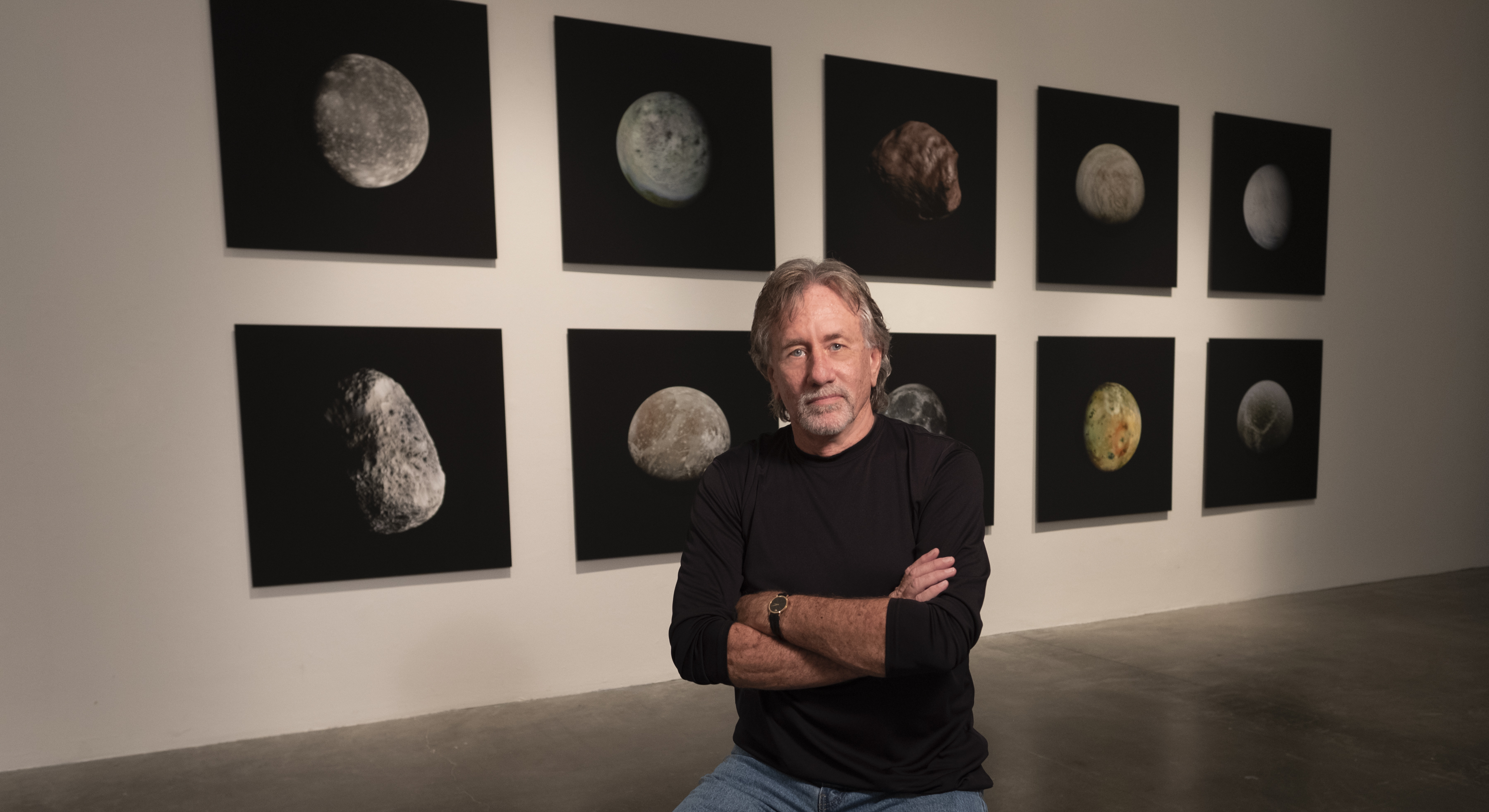 Photo of Stephen Nowlin in front of art in the Williamson Gallery. 