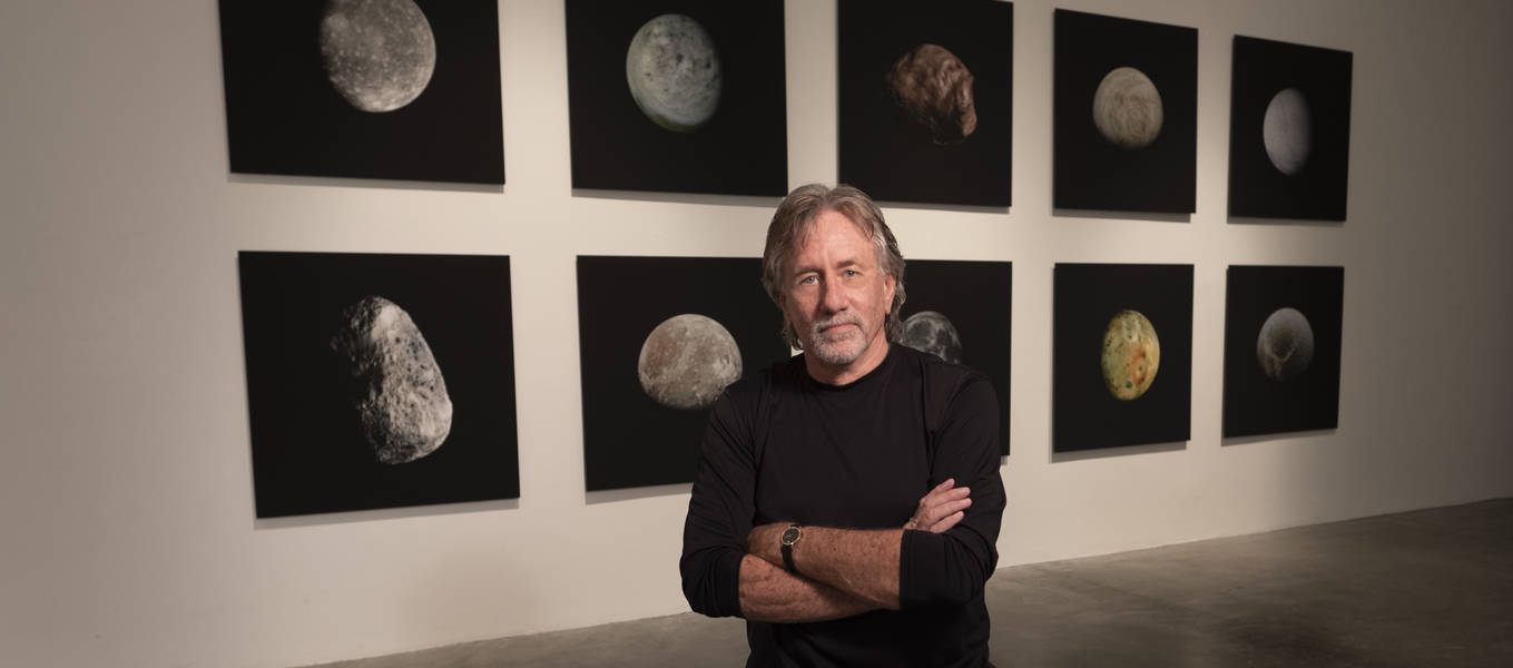 Stephen Nowlin in front of Moons exhibition