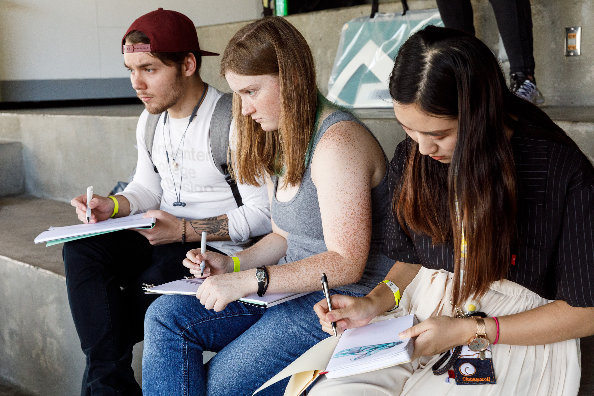 Photo of three kids sketching at Car Classic 2018.