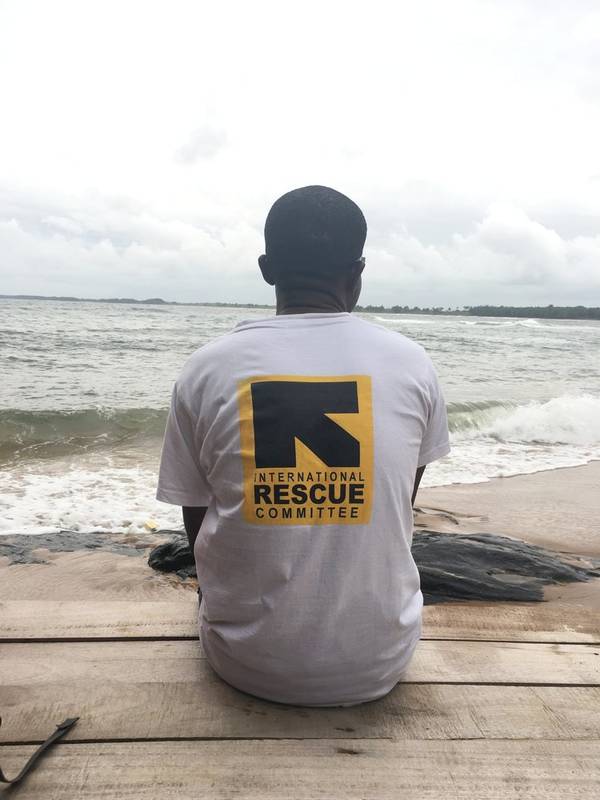 Person wearing an International Rescue Committee t-shirt