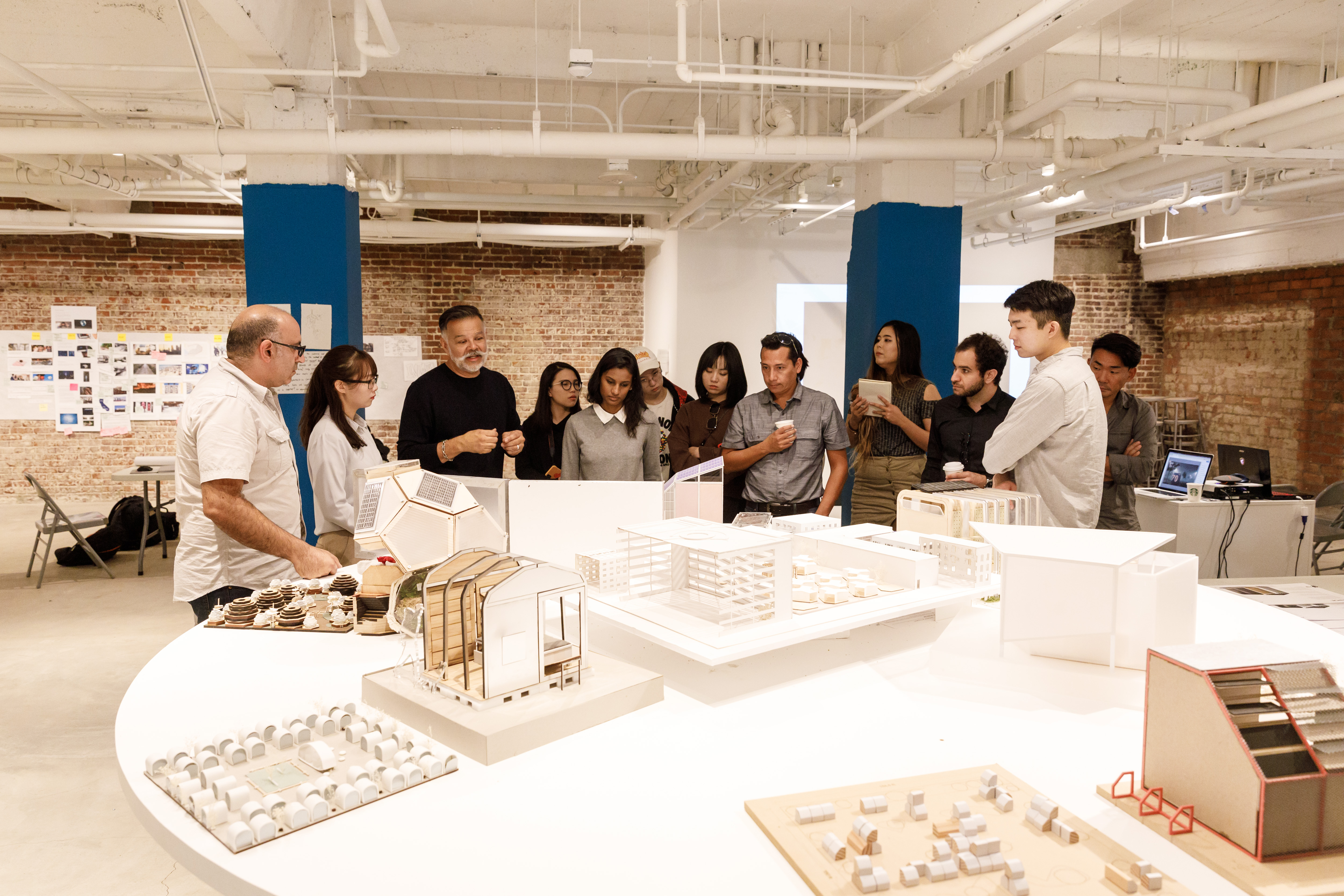 A photo of Environmental Design class Sanctum reviews housing models for L.A.’s homeless. Photo by Juan Posada.