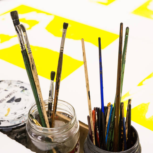 paint brushes in a jar