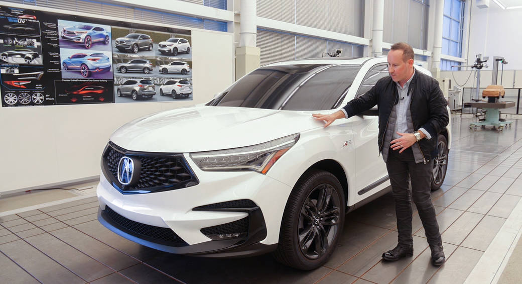 ArtCenter alumnus and Acura Lead Exterior Designer Randall Smock showing a white full-scale model of the 2019 RDX during a 2019 press tour of the Acura Design Studio in Torrance, California, photo courtesy of Acura. 