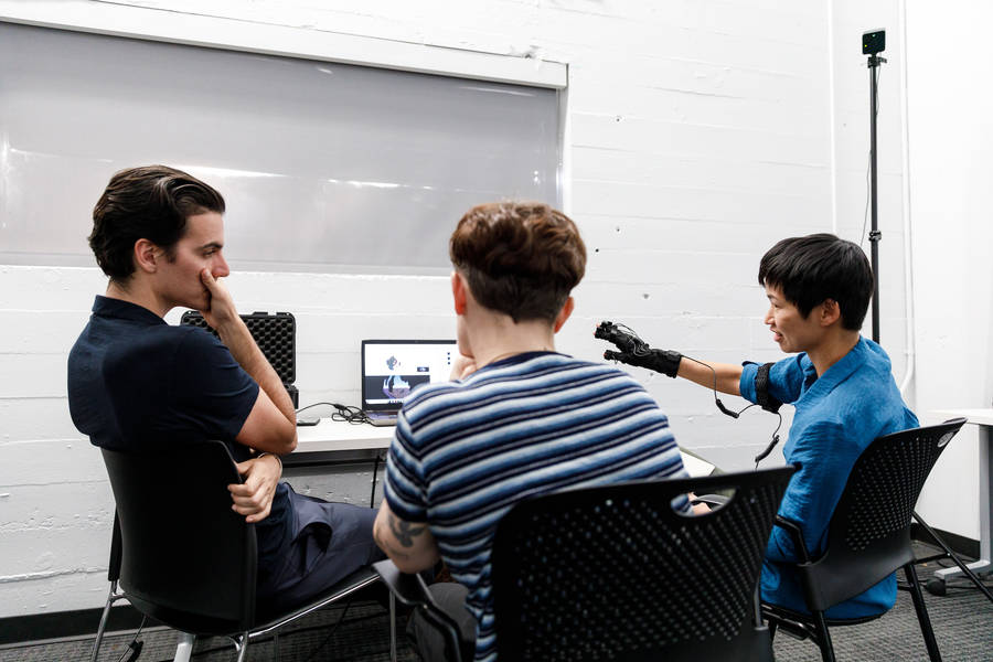 Interaction+Design+and+graduate+Media+Design+Practices+%28MDP%29+Associate+Professor+Elise+Co+wearing+a+motion-capture+glove+in+the+Spring+2019+Transdisciplinary+Studio+%28TDS%29+course+%3Ci%3EBody+Tracking%3C%2Fi%3E.+With+a+student+%28left%29+and+Interaction+Design+and+MDP+Assistant+Professor+Jenny+Rodenhouse+%28MFA+15+Media+Design%29.+