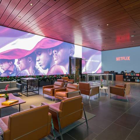 /An 80-foot-by-12-foot video screen is the Netflix lobby’s showpiece. (Via NY Times - Credit Hunter Kerhart for The New York Times) 