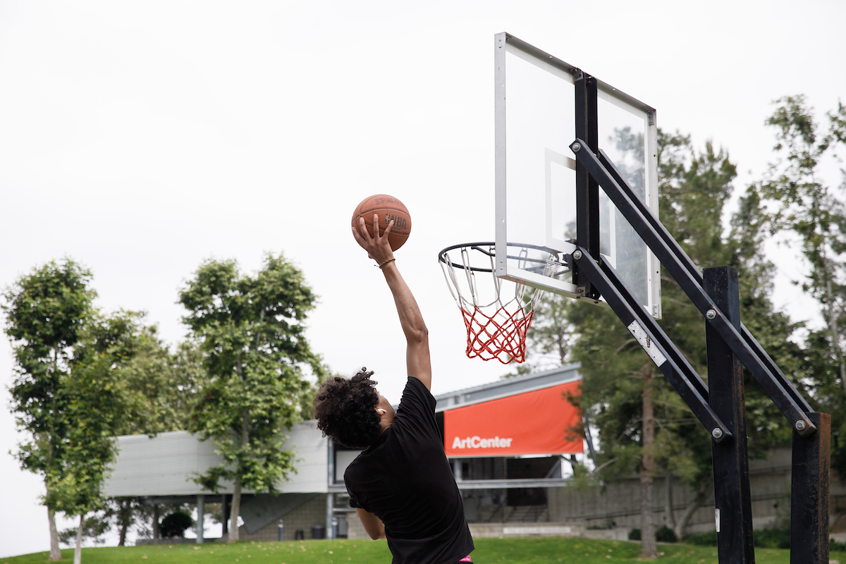 Student playing basketball on Hillside campus.