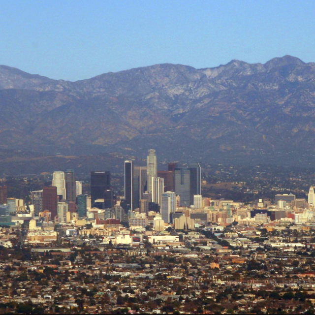 Cityscape of LA with the San Gabriel Mountains in the background