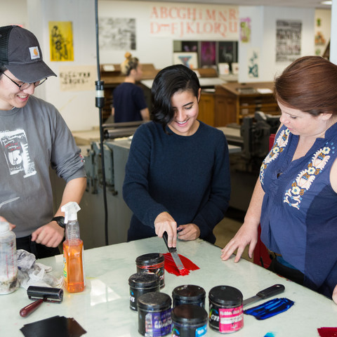 ArtCenter design students test ink colors in the letterpress studio