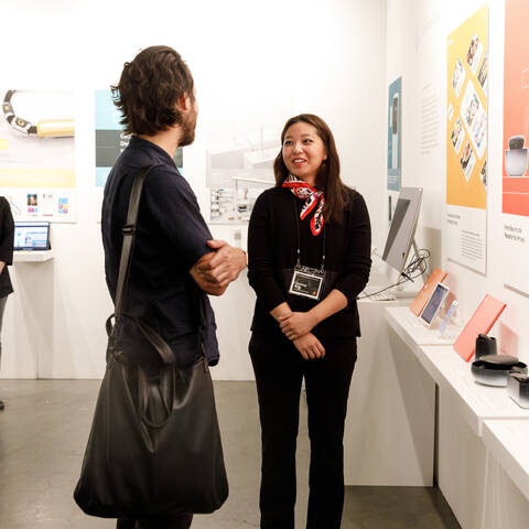 ArtCenter graduate meets with prospective employer at grad show