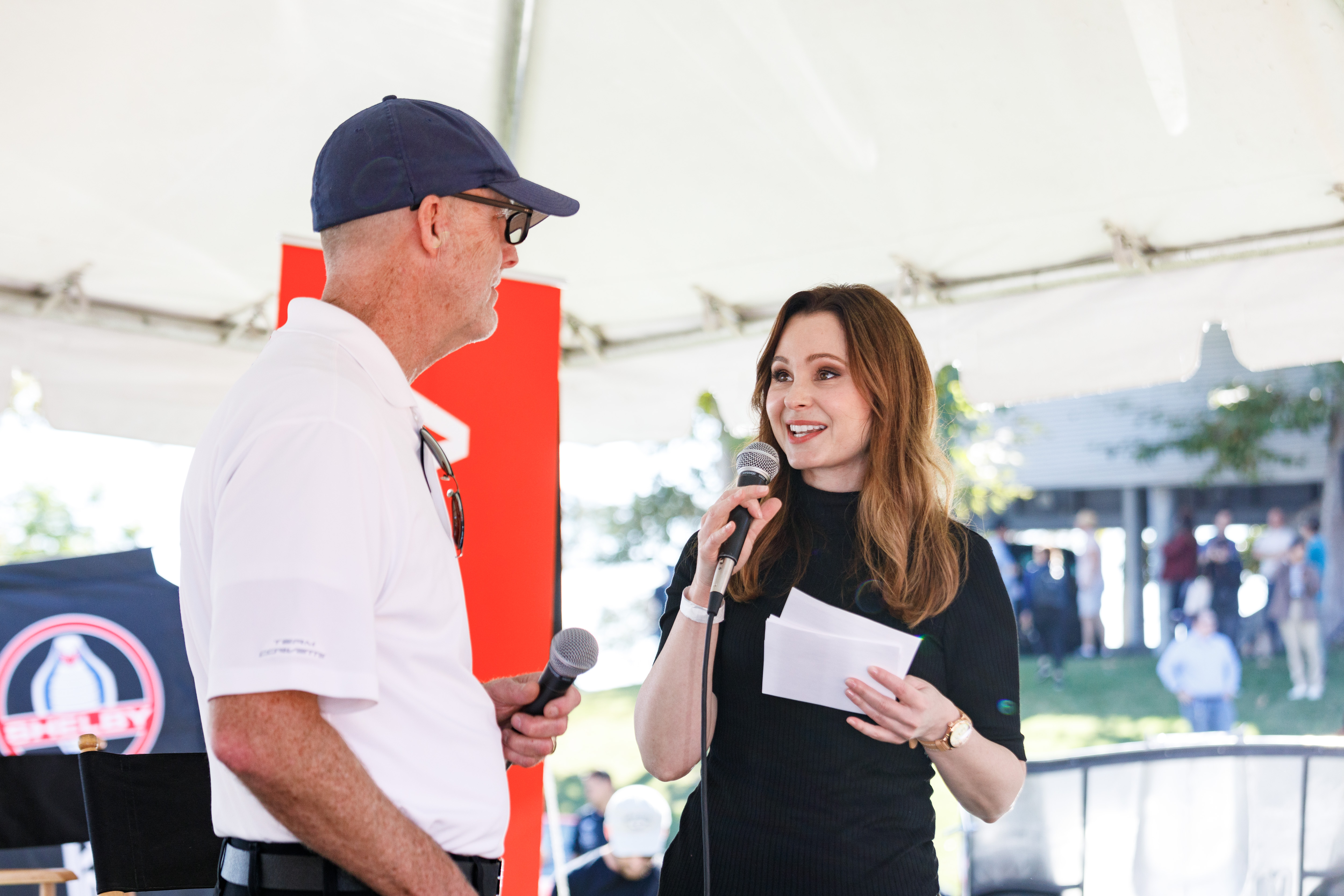 Photo of Tom Peters and Laura Burstein on stage at Car Classic 2019.