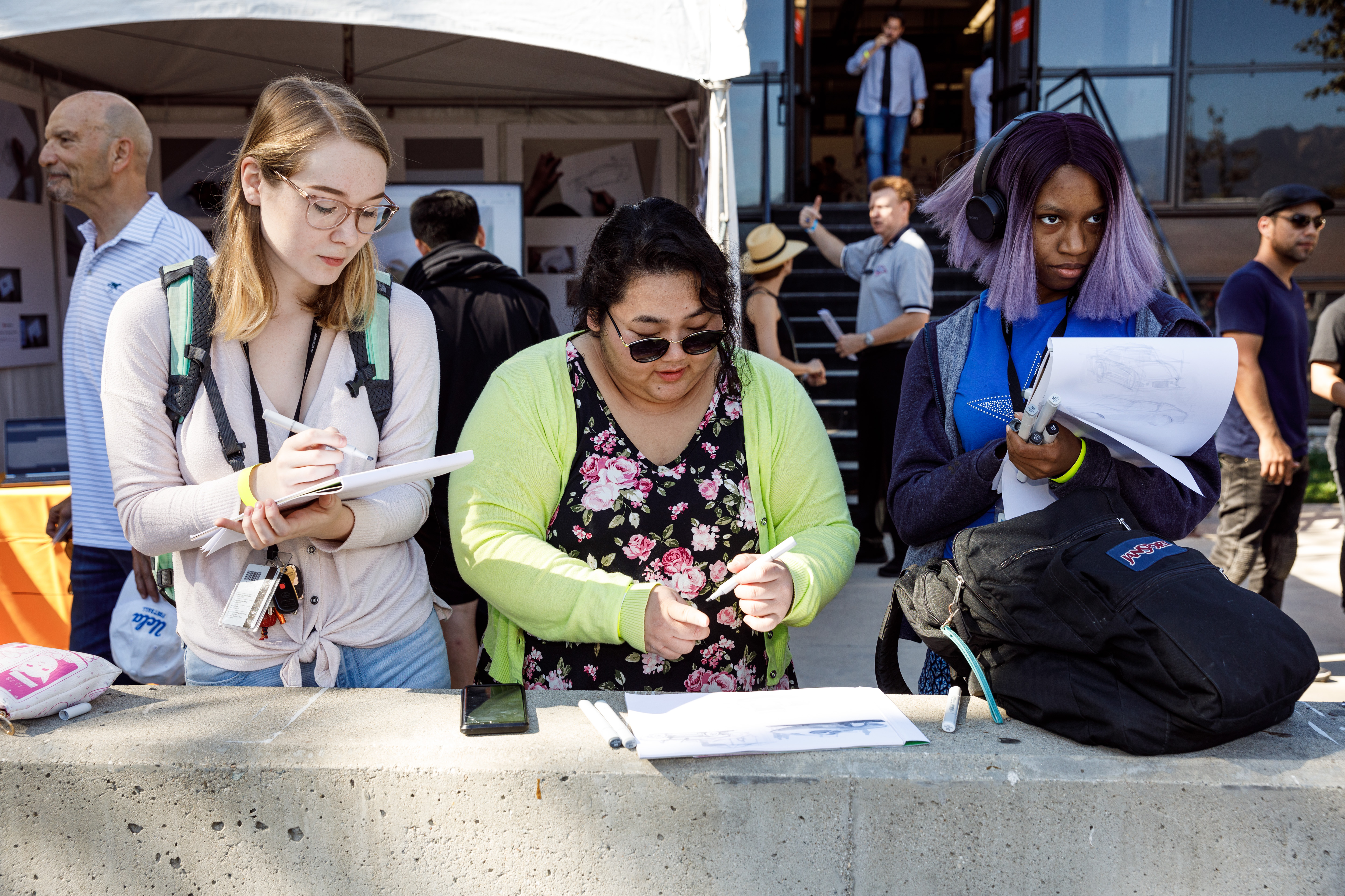 Photo of students sketching cars at Car Classic 2019.