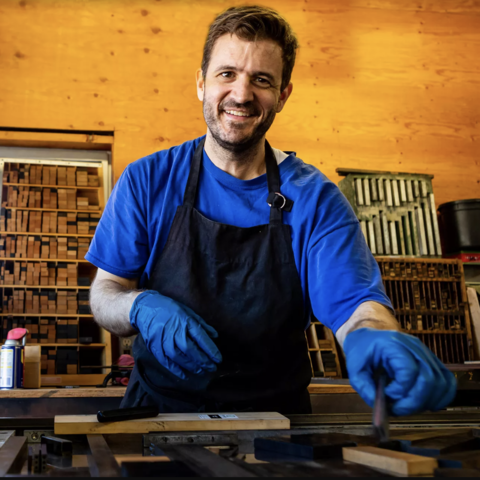 /Chad Danieley in his garage. (via The Verge)