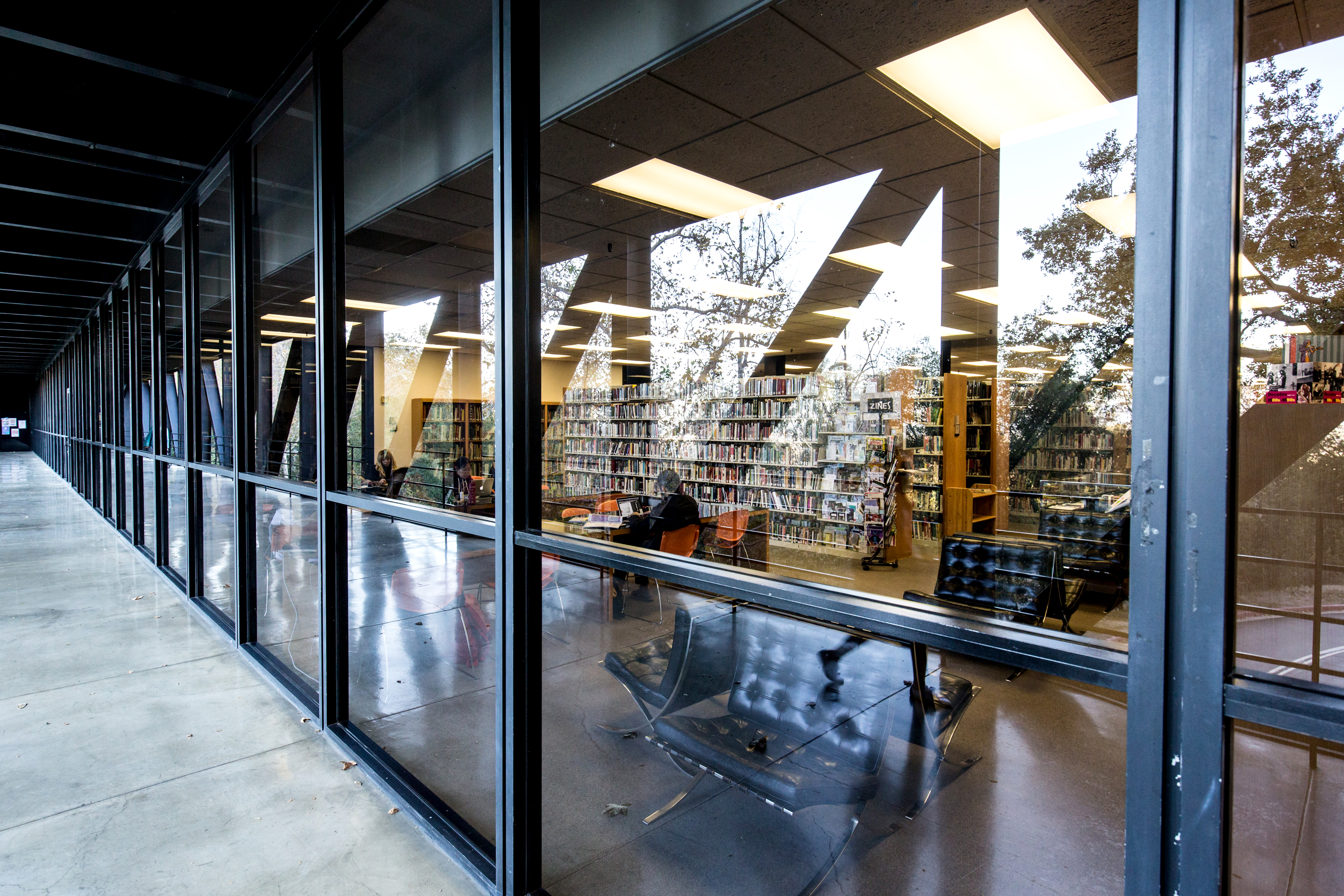 A series of windows looking into the library at ArtCenter College of Design