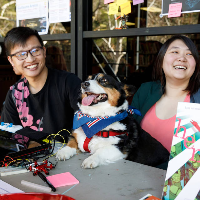 Two students and a corgie