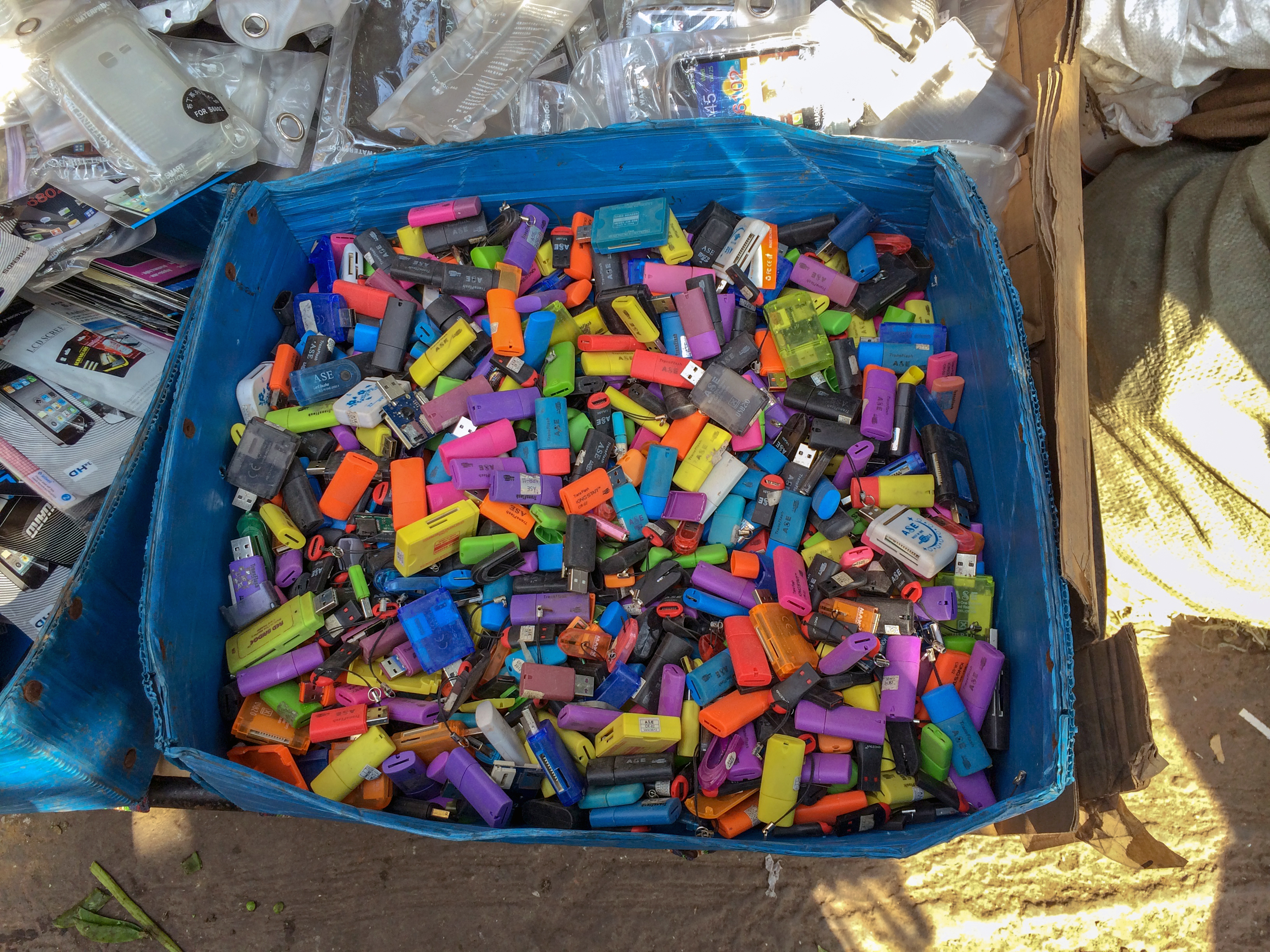Photo of a box of colorful thumbdrives.