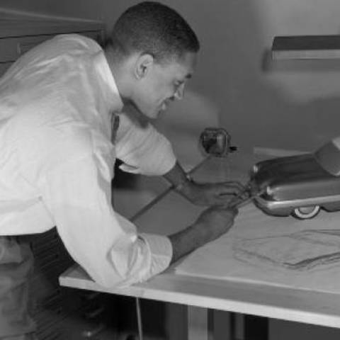 /Thompson working on a drawing (via wardsauto.com).