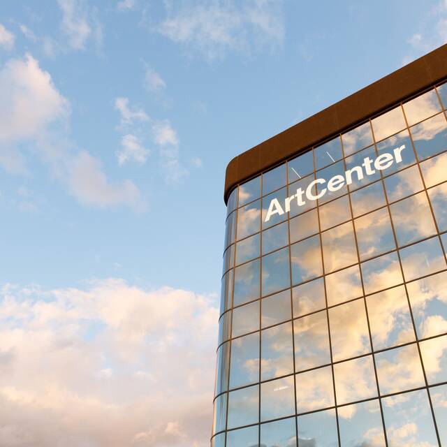 clouds on blue sky with ArtCenter building in foreground