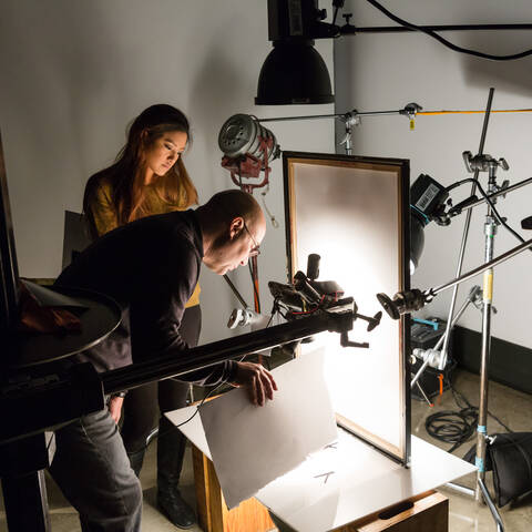 /Student and Faculty work together in the photo lab