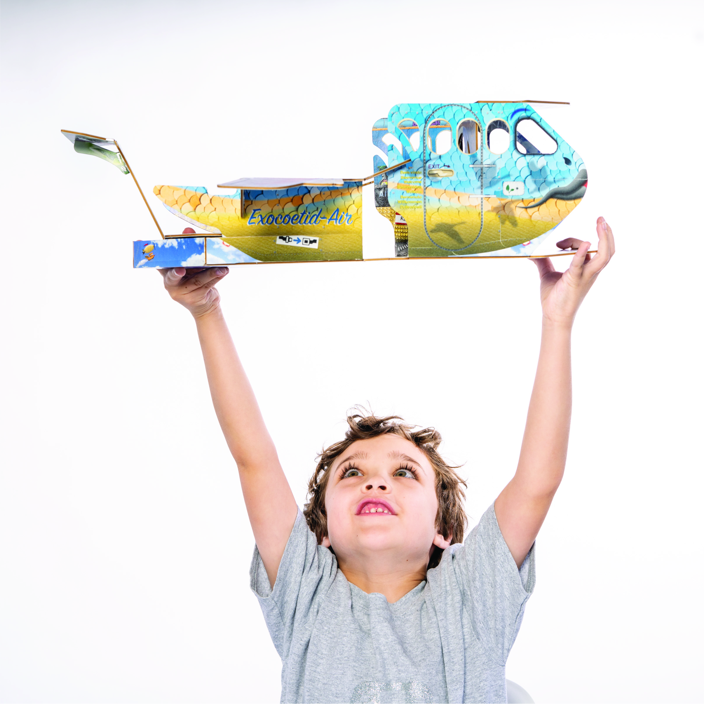 Boy plays with Archamelia airplane.
