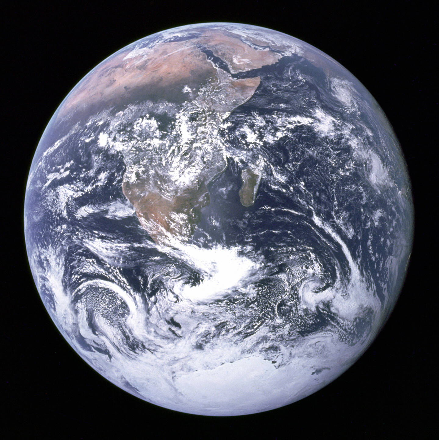 This+classic+photograph+of+the+Earth+as+seen+by+the+Apollo+17+crew+traveling+toward+the+Moon+was+taken+on+December+7%2C+1972.+It+shows+an+area+extending+from+the+Mediterranean+Sea+to+the+Antarctic+south+polar+ice+cap.+Note+the+heavy+cloud+cover+in+the+Southern+Hemisphere.+Almost+the+entire+coastline+of+Africa+is+clearly+visible.+The+Arabian+Peninsula+can+be+seen+at+the+northeastern+edge+of+Africa.+The+large+island+off+the+coast+of+Africa+is+Madagascar.+The+Asian+mainland+is+on+the+horizon+toward+the+northeast.