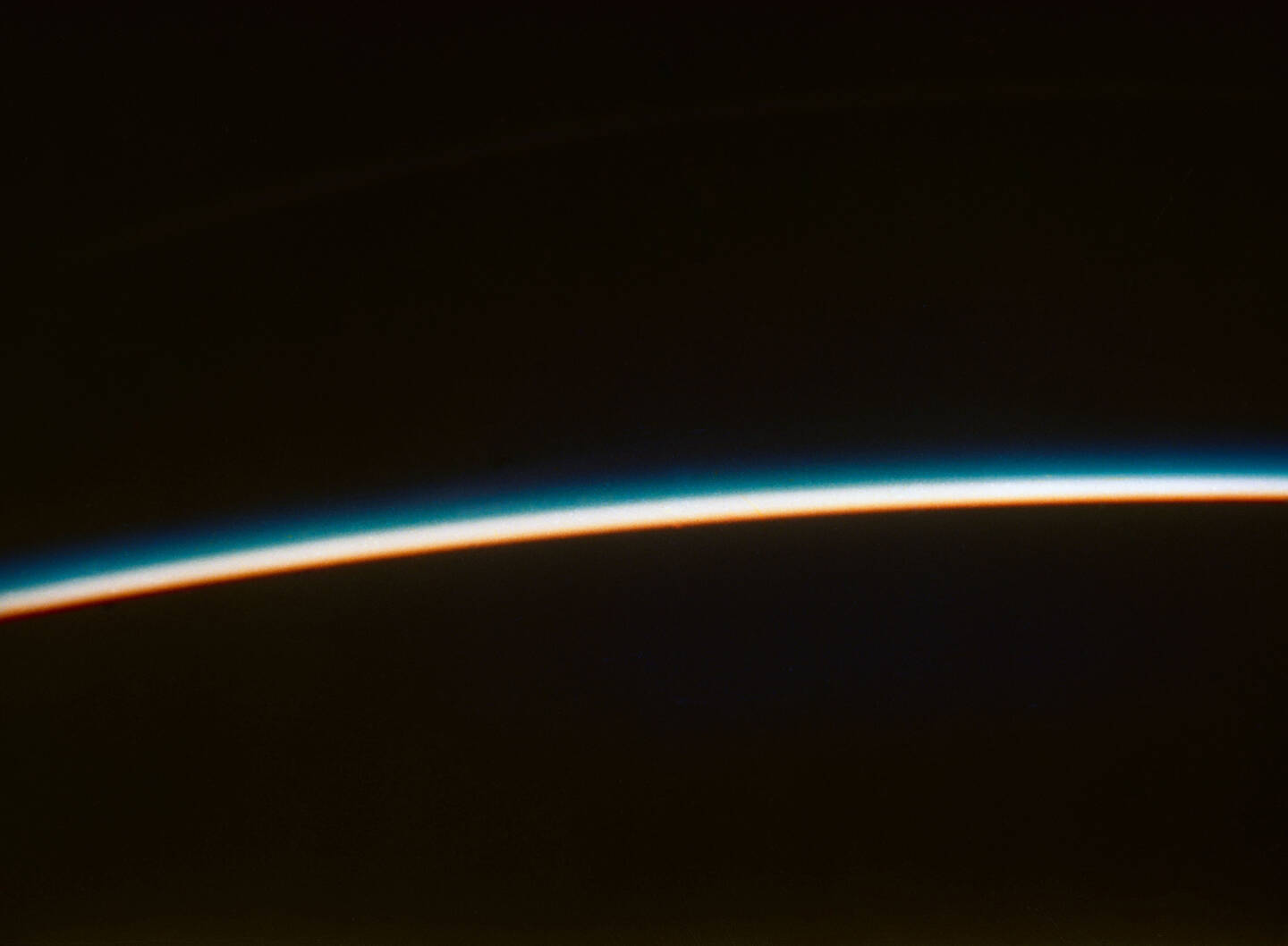 One+of+the+first+images+of+the+Earth%E2%80%99s+thin+atmosphere%2C+this+photograph+was+taken+from+space+on+February+20%2C+1962%2C+by+the+astronaut+John+Glenn+during+his+orbital+flight+on+a+Mercury+spacecraft.+Glenn+used+his+own+Leica+camera+to+take+the+photograph.