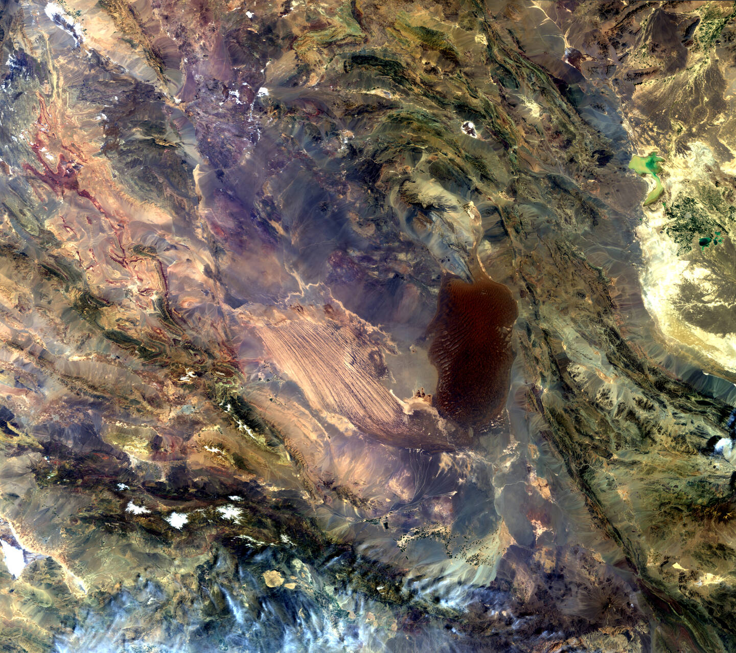 Dasht-e+Lut%2C+or+the+Lut+Desert%2C+a+salt+desert+in+southeast+Iran%2C+is+often+called+the+hottest+place+on+Earth.+The+highest+land+surface+temperature+ever+recorded+there+was+70.7%C2%BAC+%28about+159%C2%B0F%29.+The+light+area+in+the+center+is+the+long%2C+parallel+wind-carved+ridges+and+furrows.+The+darker+area+to+the+east+is+a+region+of+massive+sand+dunes%2C+some+reaching+as+high+as+300+meters+%28975+feet%29.+In+the+upper+right+is+a+light+green+shallow+body+of+water+that+straddles+Iran%E2%80%99s+border+with+Afghanistan.+Irrigation+expansion%2C+combined+with+droughts%2C+has+caused+the+water+levels+in+these+wetlands+to+drop+significantly+and%2C+in+some+years%2C+even+to+dry+up.+April+2%2C+2012.