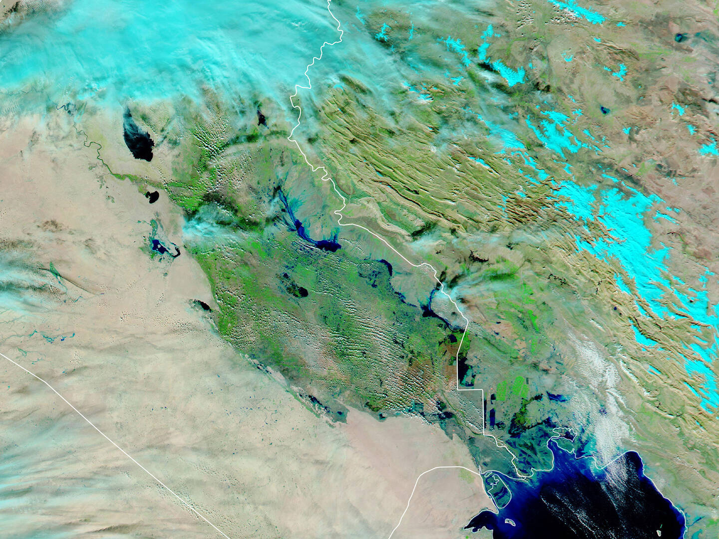 In+late+November+2018+torrential+rains+swept+across+northern+and+central+Iraq%2C+causing+flash+floods+and+widespread+devastation.+Using+a+combination+of+infrared+and+visible+light%2C+this+false-color+image+shows+water+pooling+in+floodplains.+Floodwater+appears+dark+blue%2C+saturated+soil+is+light+blue%2C+vegetation+is+bright+green%2C+and+bare+ground+is+brown.+November+27%2C+2018.