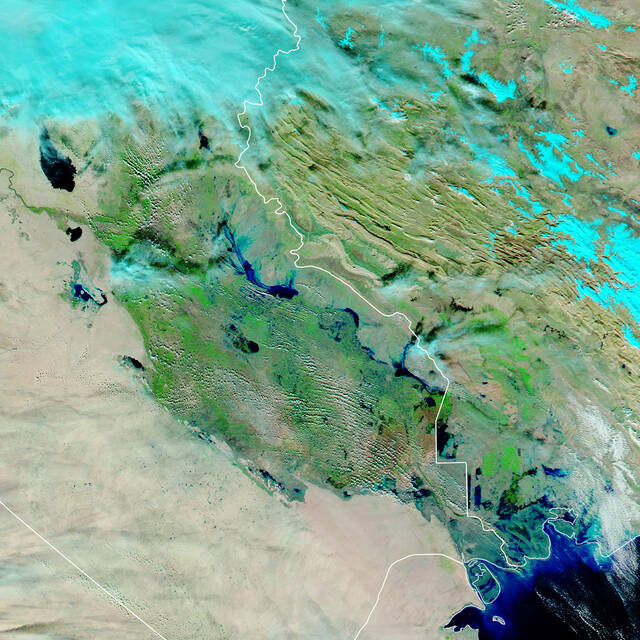 In+late+November+2018+torrential+rains+swept+across+northern+and+central+Iraq%2C+causing+flash+floods+and+widespread+devastation.+Using+a+combination+of+infrared+and+visible+light%2C+this+false-color+image+shows+water+pooling+in+floodplains.+Floodwater+appears+dark+blue%2C+saturated+soil+is+light+blue%2C+vegetation+is+bright+green%2C+and+bare+ground+is+brown.+November+27%2C+2018.