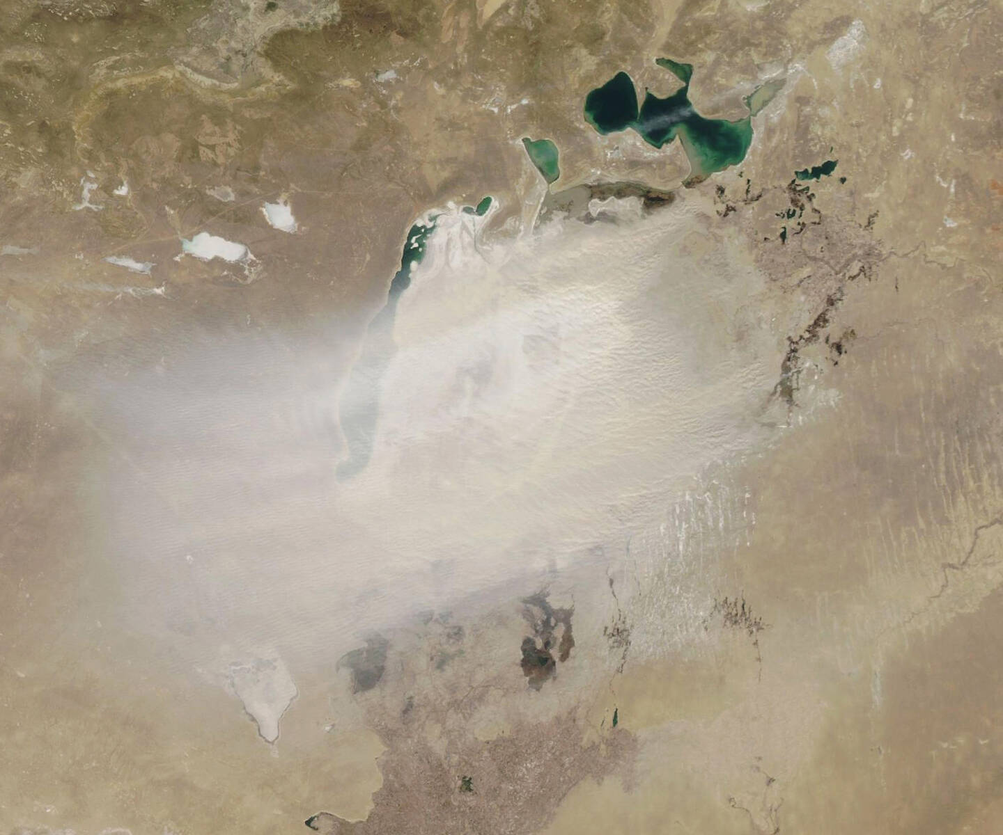 A+natural-color+image+of+a+dust+storm+over+the+Aral+Sea%2C+a+once+vast+inland+lake.+Much+of+the+dust+appeared+to+be+coming+from+a+desert%2C+which+has+emerged+as+the+Aral+Sea+has+dried+in+recent+decades.+In+the+1960s+the+Soviet+Union+diverted+rivers+going+into+the+immense+lake+for+agriculture+in+nearby+republics.+Dry+lake+beds+are+abundant+sources+of+atmospheric+dust+because+they+are+filled+with+light%2C+fine-grained+sediment+that+winds+can+easily+lift.+March+24%2C+2020.