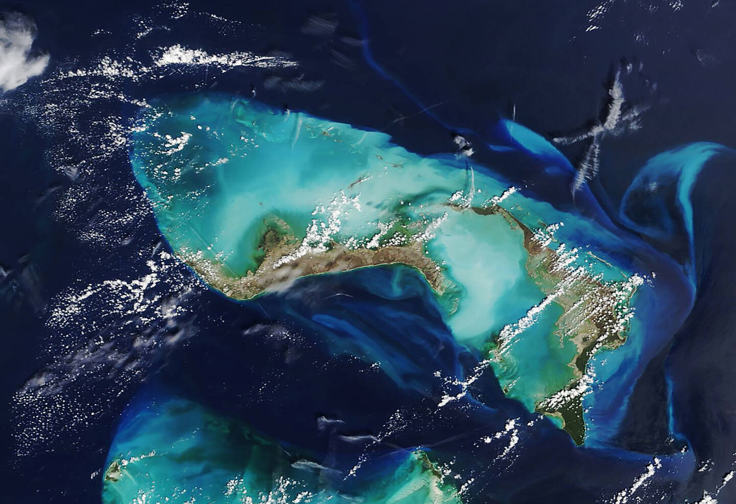 Hurricane+Dorian+devastated+the+northern+Bahama+islands+for+nearly+forty+hours+in+September+2019.+According+to+the+National+Hurricane+Center%2C+the+storm%E2%80%99s+landfall+on+September+1+tied+with+one+in+1935+as+the+strongest+Atlantic+hurricane+landfall+on+record.+The+image+shows+widespread+browning+of+Grand+Bahama+%28left%29+and+Abaco+islands+from+damaged+vegetation.+The+brightening+of+the+reefs+and+shoals+near+the+islands+is+due+to+sediment+that+the+storm+stirred+up.+September+7%2C+2019.