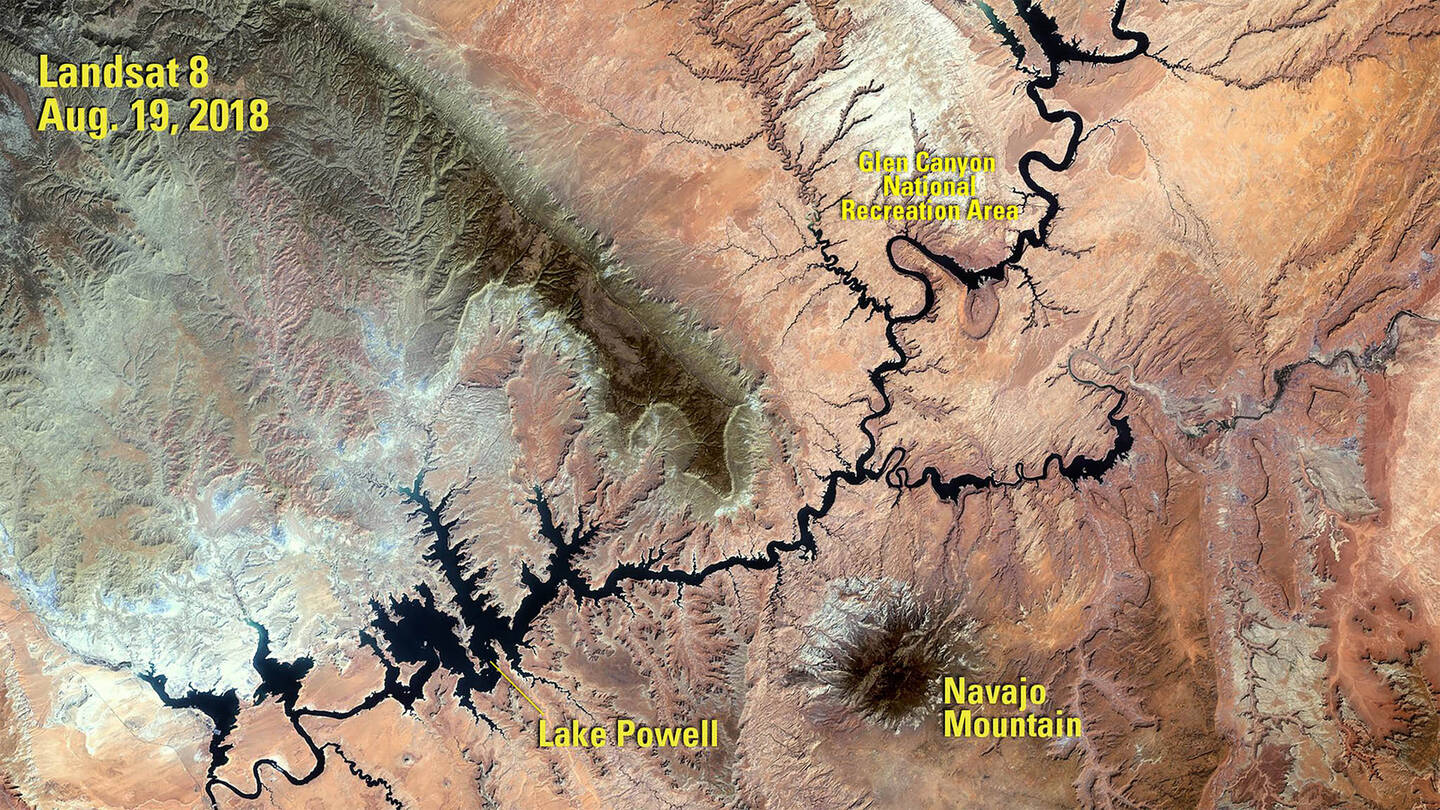 This+image+of+Lake+Powell+was+taken+in+2018+following+a+period+of+drought+that+began+in+2000.+When+the+water+volume+was+measured+five+months+later%2C+it+was+less+than+half+of+what+the+lake+can+hold.+Powell+is+a+reservoir%2C+formed+in+1963+when+the+Glen+Canyon+Dam+was+built+on+the+Colorado+River.+It+lies+primarily+in+Utah%2C+with+its+southern+end+at+the+dam+in+northern+Arizona.