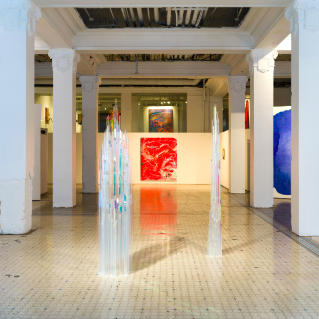 MMXXI exhibition: glass tower white columns, red painting, blue painting