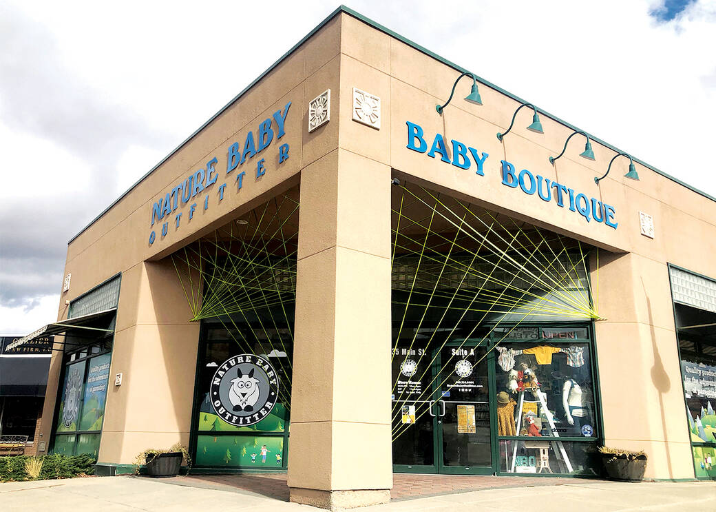 Recycled yarn installation by Elyse Marks for Downtown Stories Kalispell, for Nature Baby Outfitter and the Kalico Art Center, 2020.