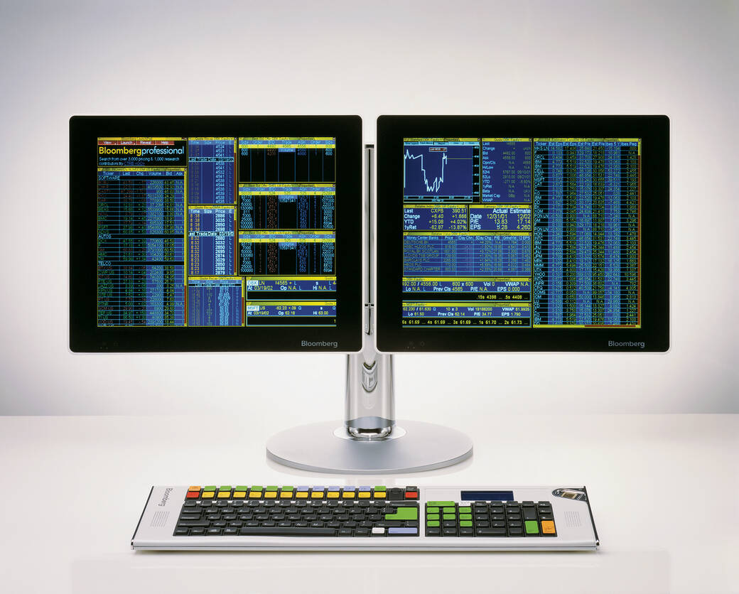 Photo of the Bloomberg display and keyboard, which features two screens and a keyboard with brightly colored keys.