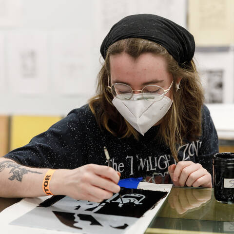 ArtCenter student works on ink project.
