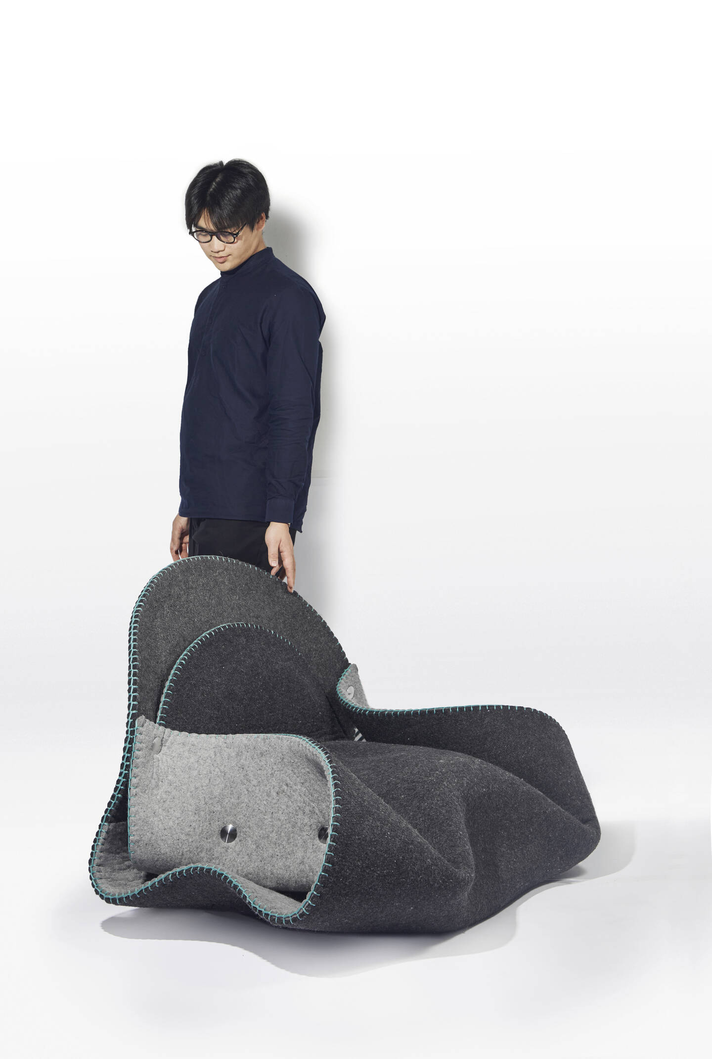 Fortune+Fold+is+derived+from+the+folding+process+of+making+dumplings+from+my+childhood.+The+form+is+folded+and+sculpted+with+one+sheet+of+felt.+It%E2%80%99s+fastened+with+six+aluminum+fasteners.+The+playful+outline+brings+an+optimistic+aura+to+the+room.