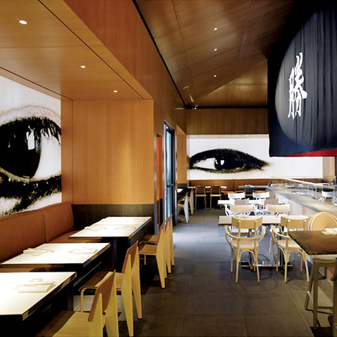 /rendering of restaurant dining room wit two large eyes