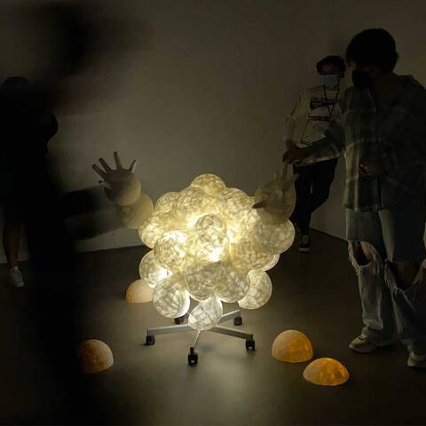 interactive+performative+installation+with+molded+paper+sculpture%2C+lights%2C+gloves%2C+chair+with+wheels.