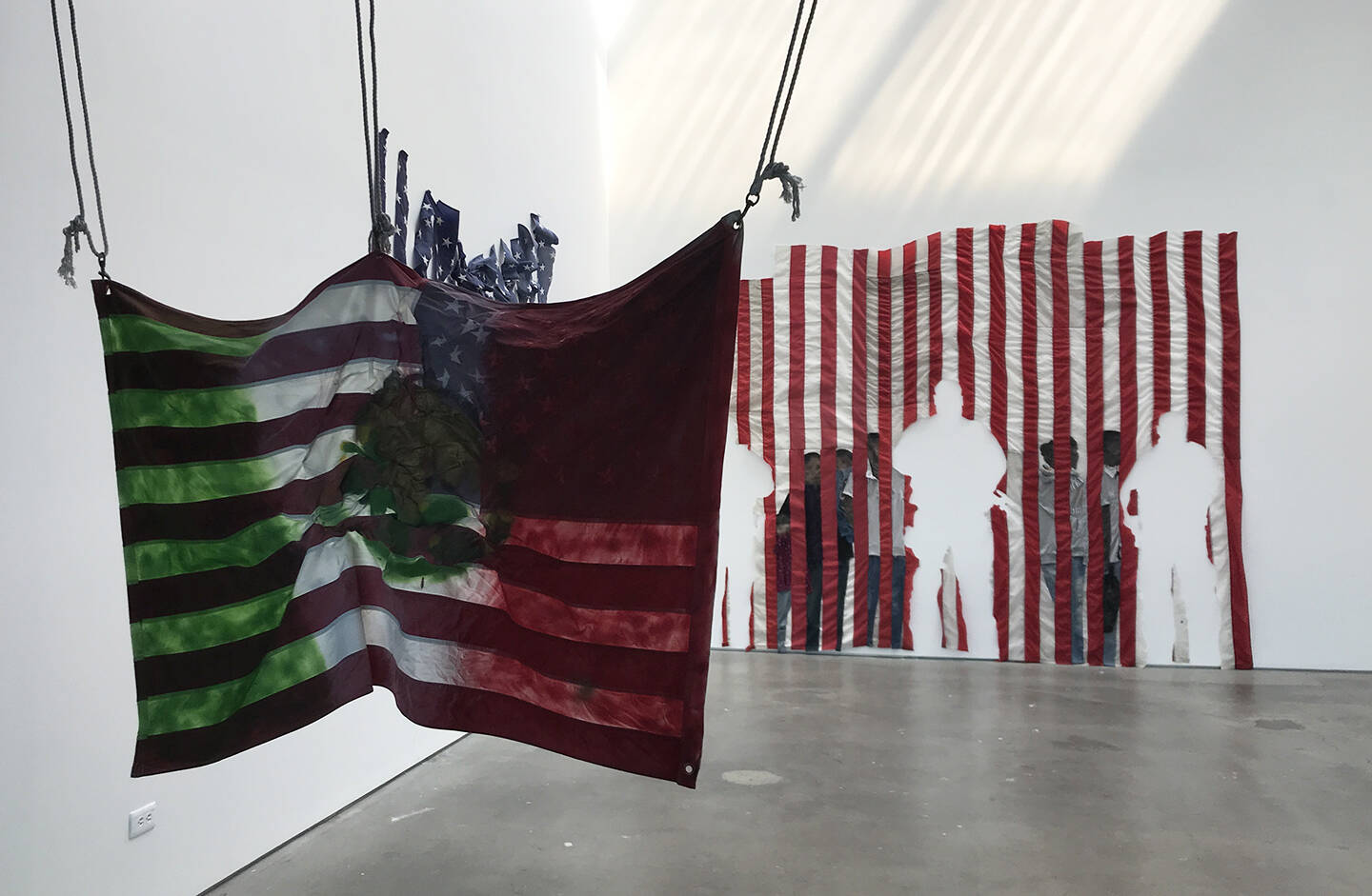 Large+scale+sewn+textile+constructions+and+paintings+with+American+flags%2C+found+clothing+and+rope.