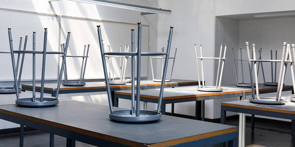 several upturned tools on top of a long table