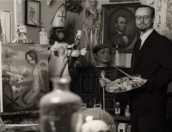 An earlier photo of Mark Ryden with his work. 
