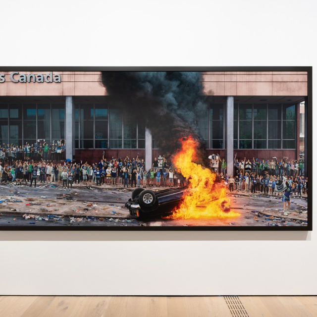 /a picture of Stan Douglas artwork in gallery of car on fire
