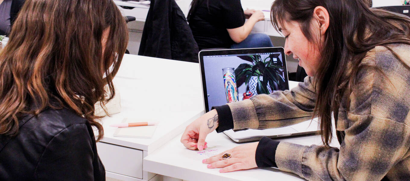 Las Fotos Project student Wendy Cubillo (left) and Photography and Imaging alum Rhombie Sandoval (right) at Las Fotos Project in 2022 for a Night to Network event. Photo by Stephanie Gutierrez, courtesy of Las Fotos Project.